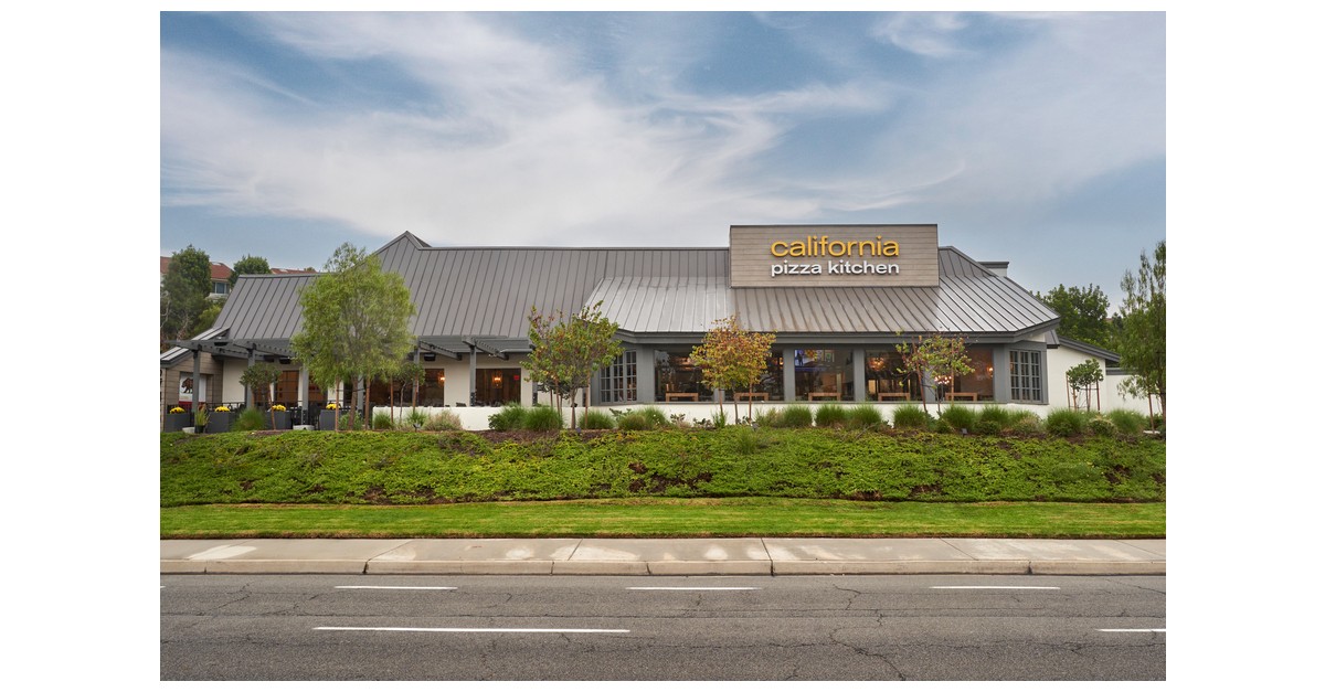 California Pizza Kitchen restaurant exterior with metal roof and illuminated sign