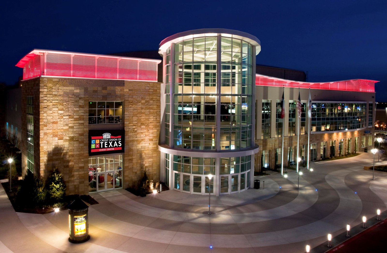 Credit Union of Texas Event Center in Allen, Texas at night with red accent lighting
