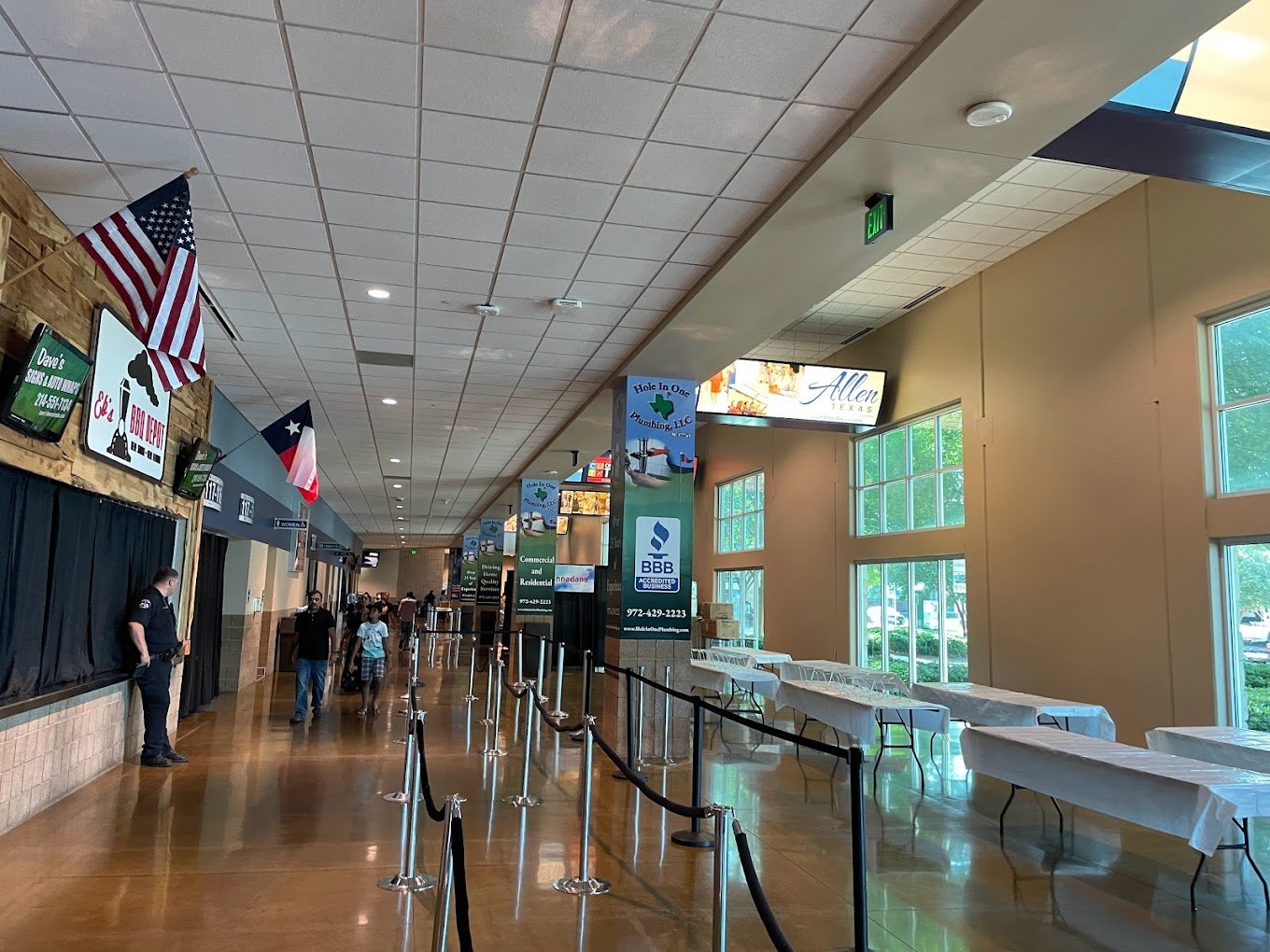 Concourse at the Credit Union of Texas Event Center with digital displays above the walkway