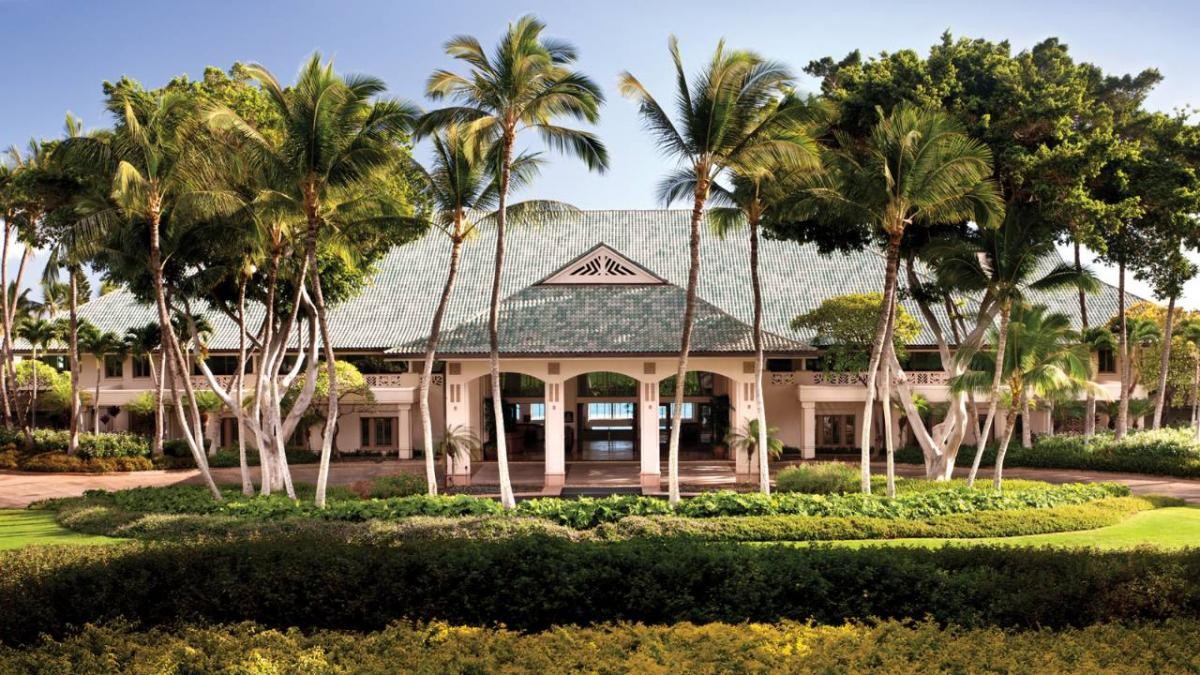 Four Seasons Lanai resort entrance framed by palm trees