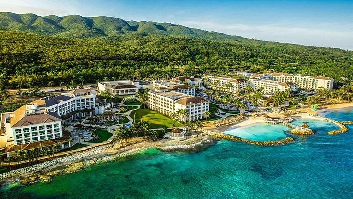 Aerial view of Hyatt Ziva Rose Hall resort buildings, beach and turquoise water in Montego Bay