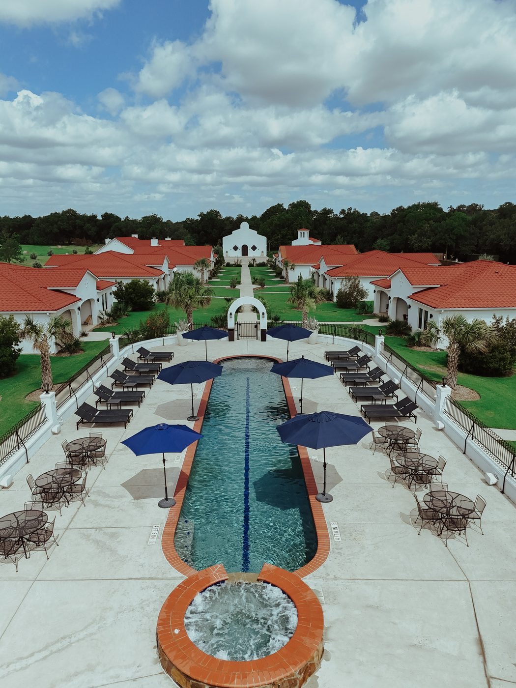Aerial view of the pool, spa and courtyard looking toward the chapel