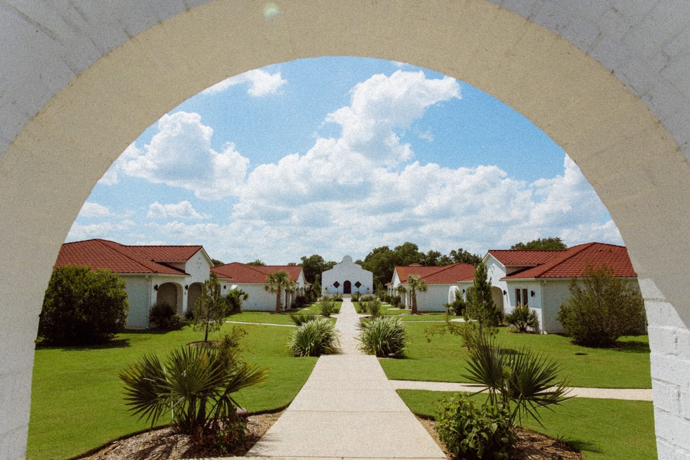 Walkway from the arch past the casitas toward the chapel