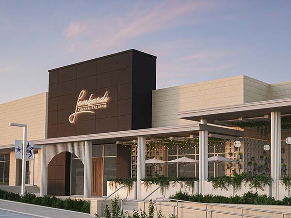 Lombardi Cucina Italiana restaurant exterior at dusk with illuminated sign and covered patio